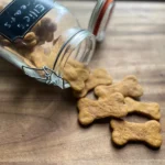 Simple Homemade Dog Treats spilling out of jar