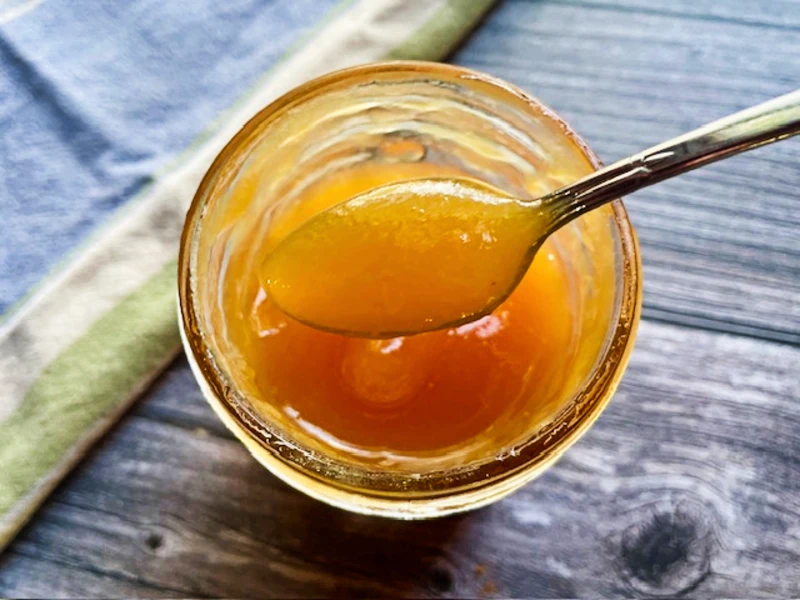 Spreadable peach butter made from ripe summer peaches, simple preserving recipe.