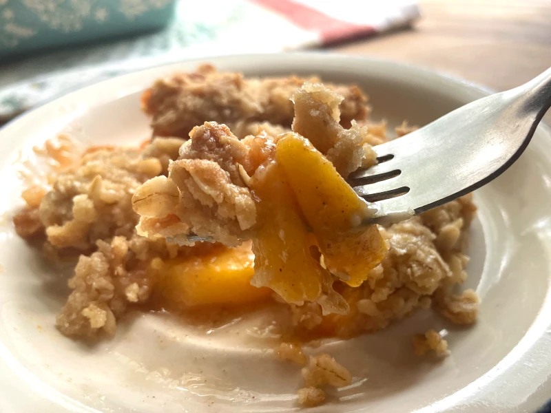 a bite of peach crisp