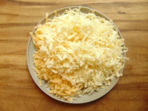 shredded sharp cheddar and Gruyere cheese for creamy mac and cheese