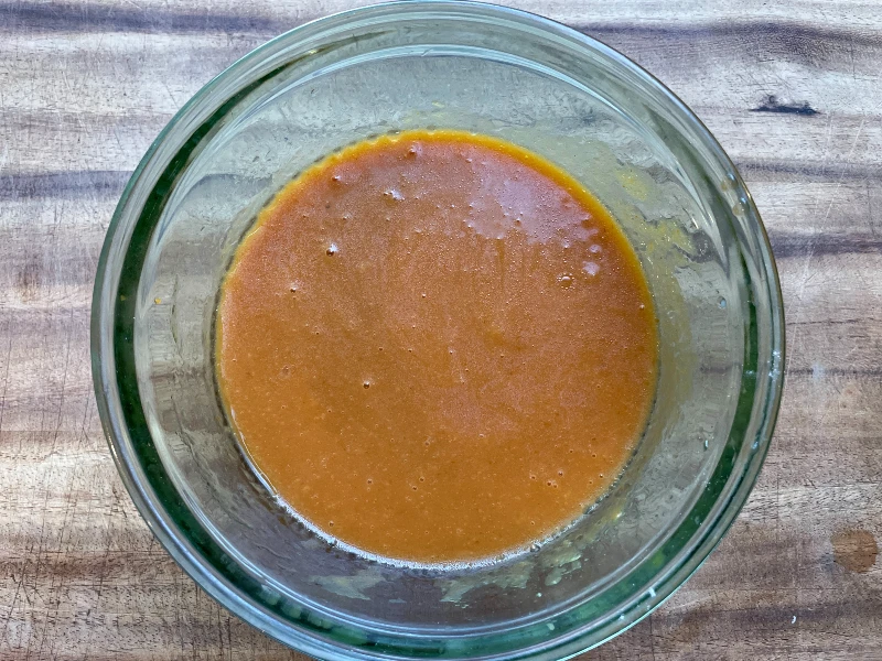 mini pumpkin muffin wet ingredients in a bowl