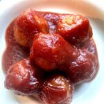 Saucy cranberry chili meatballs served on a plate