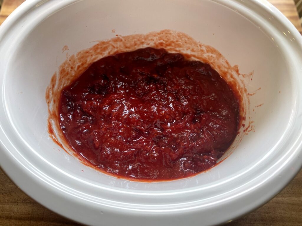 cranberry and chili sauce mixed together for cranberry chili meatballs
