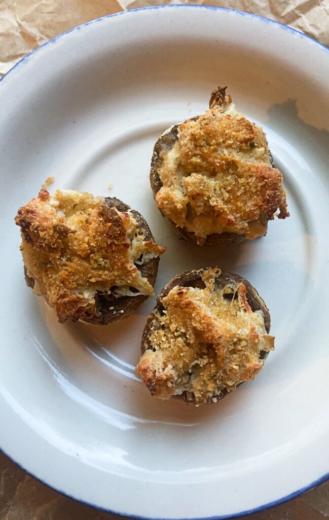 creamy stuffed mushrooms on a serving plate