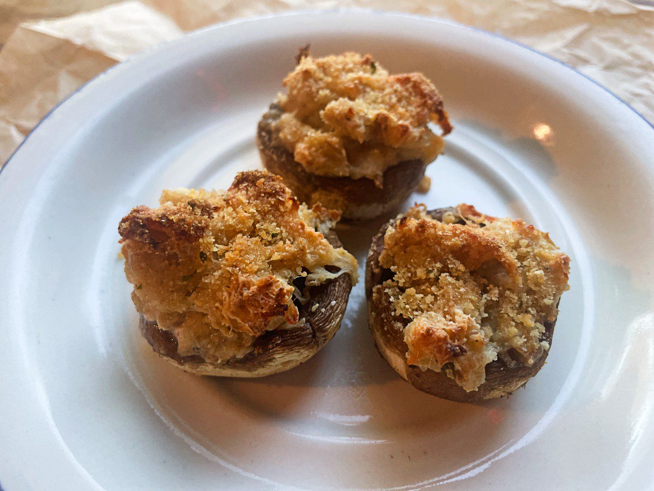 creamy stuffed mushrooms on a serving plate