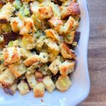 sourdough herb stuffing in a white baking dish