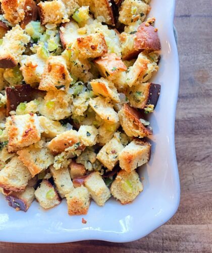 sourdough herb stuffing in a white baking dish