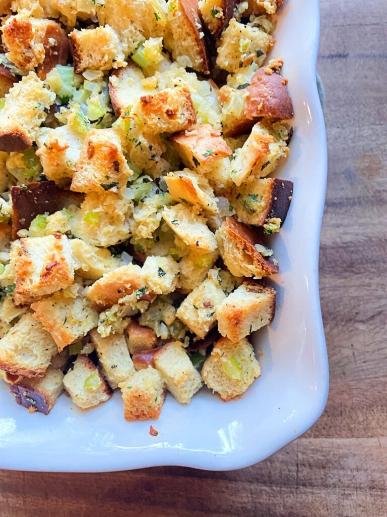 sourdough herb stuffing in a white baking dish