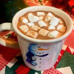 Warm cocoa topped with marshmallows.