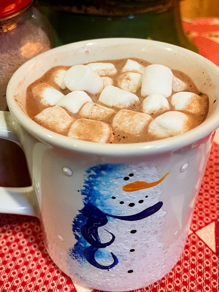 Warm cocoa topped with marshmallows