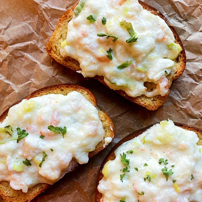 Three shrimp toast slices with toppings