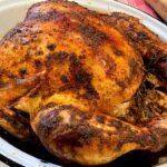 Golden brown roasted turkey in roasting pan