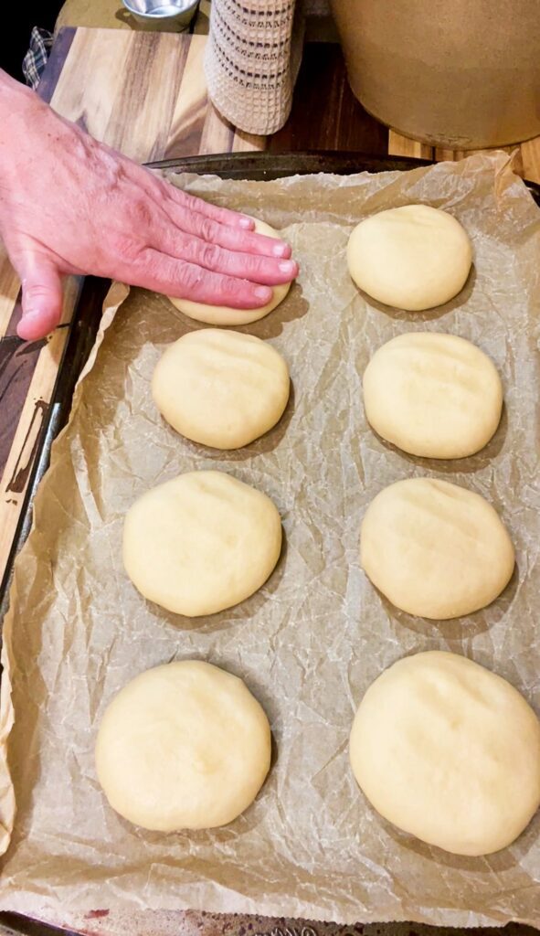 gently pressing down dough before rise
